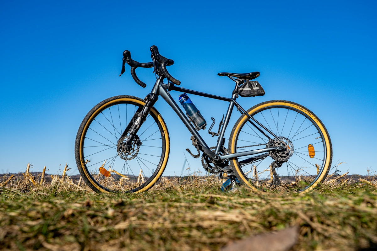a bike parked in the middle of a field