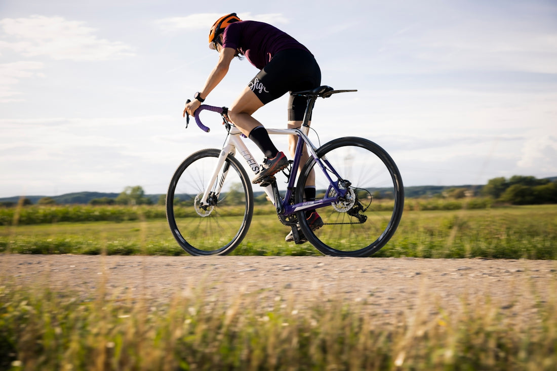 a man riding a bike on a road