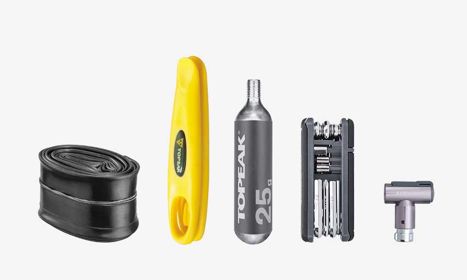 Bidón portaherramientas Topeak Escape Pod M negro – ejemplo de contenido talla M